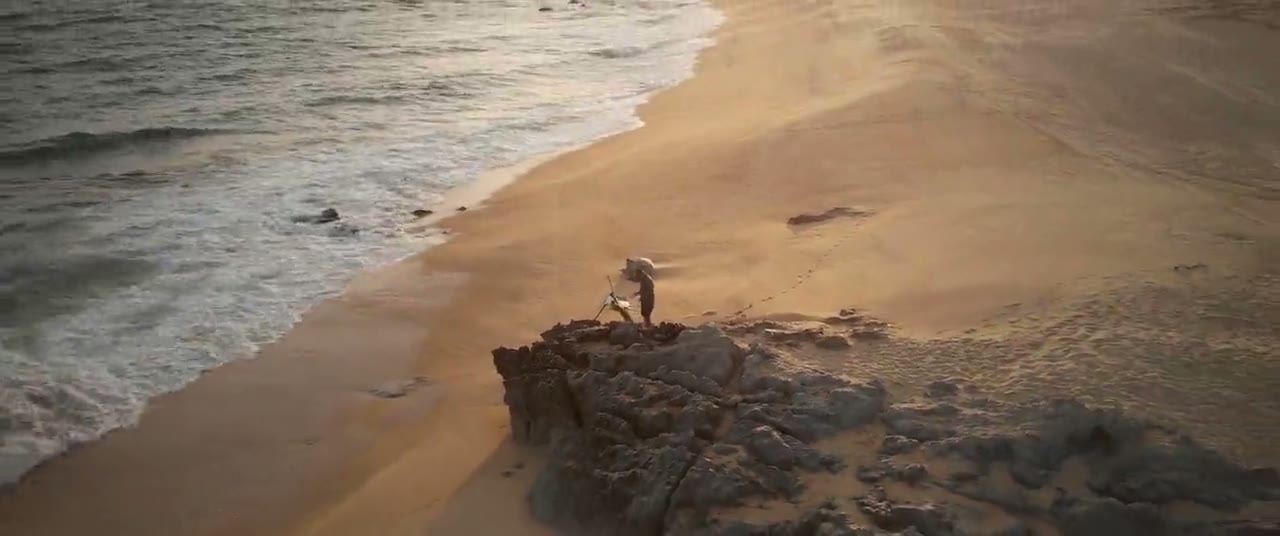 Painting on the rocks at sunset