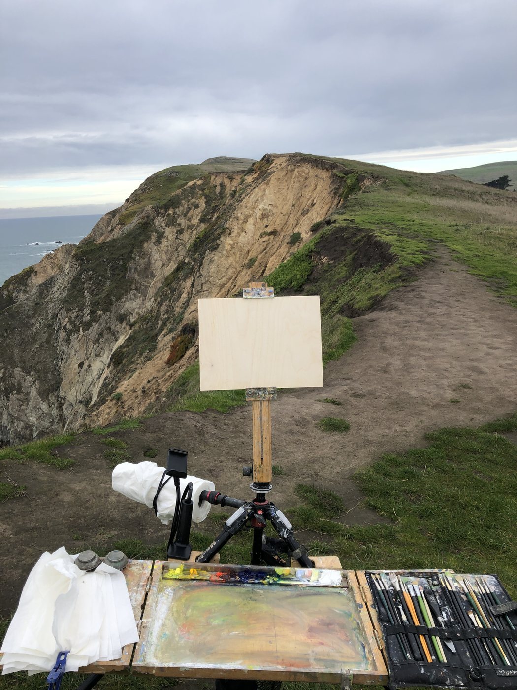 The fold-out easel on a headland near Inverness, California, panel up, palette open
